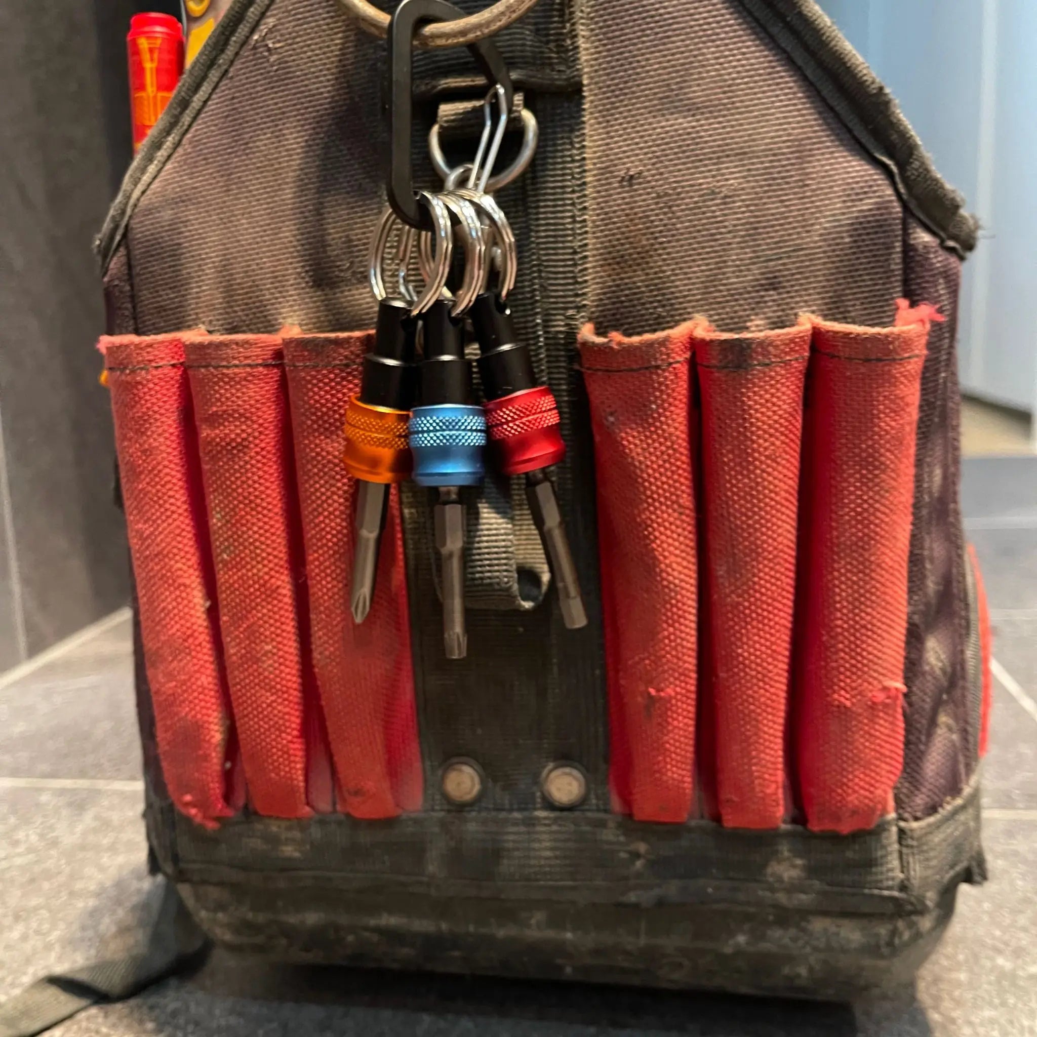 Keychain Bit Holders hanging on a toolbox for easy access and storage