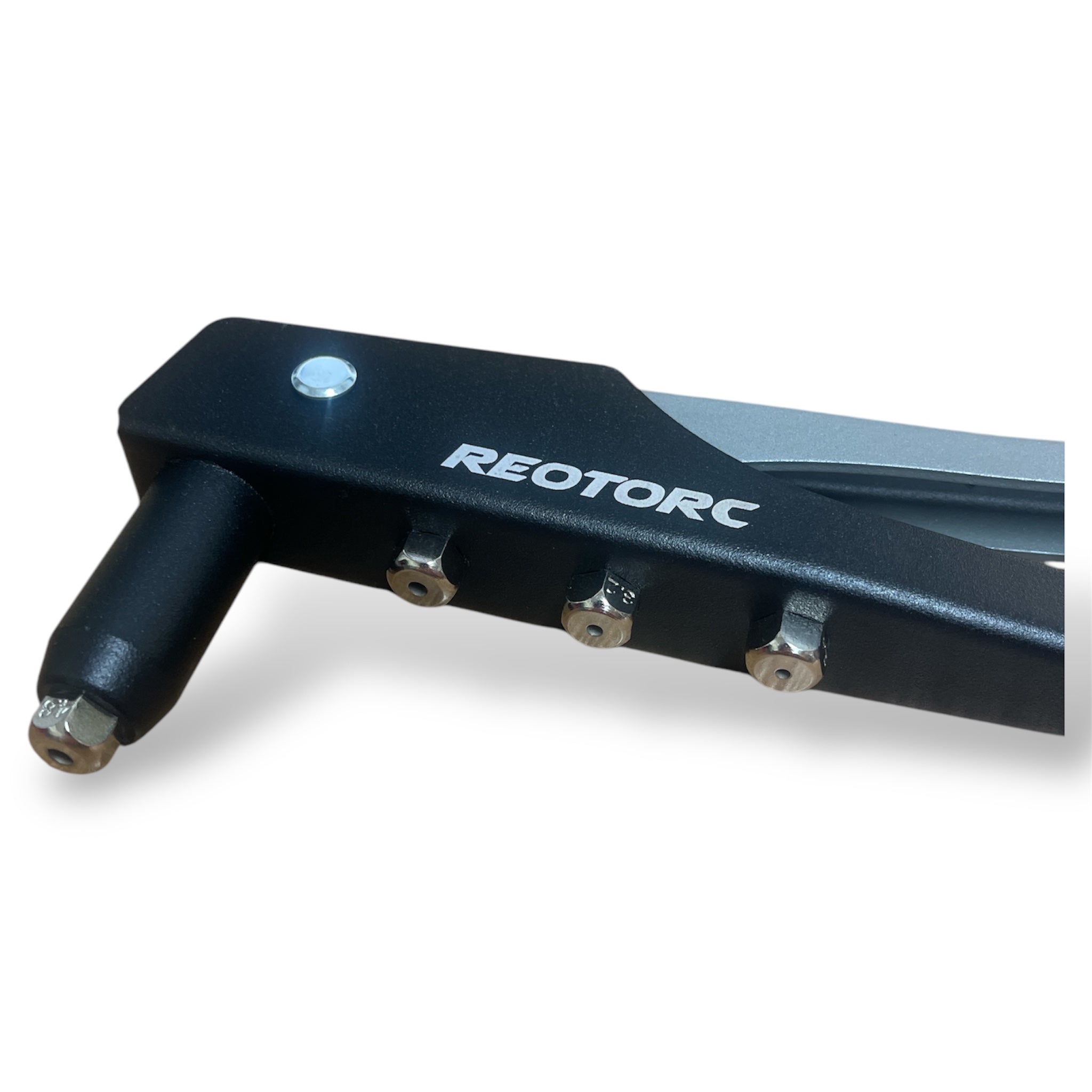 Front view of REOTORC riveter head with various rivet tips attached to the body